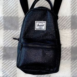 Herschel mini cross body bag in all black with sparkle accents
